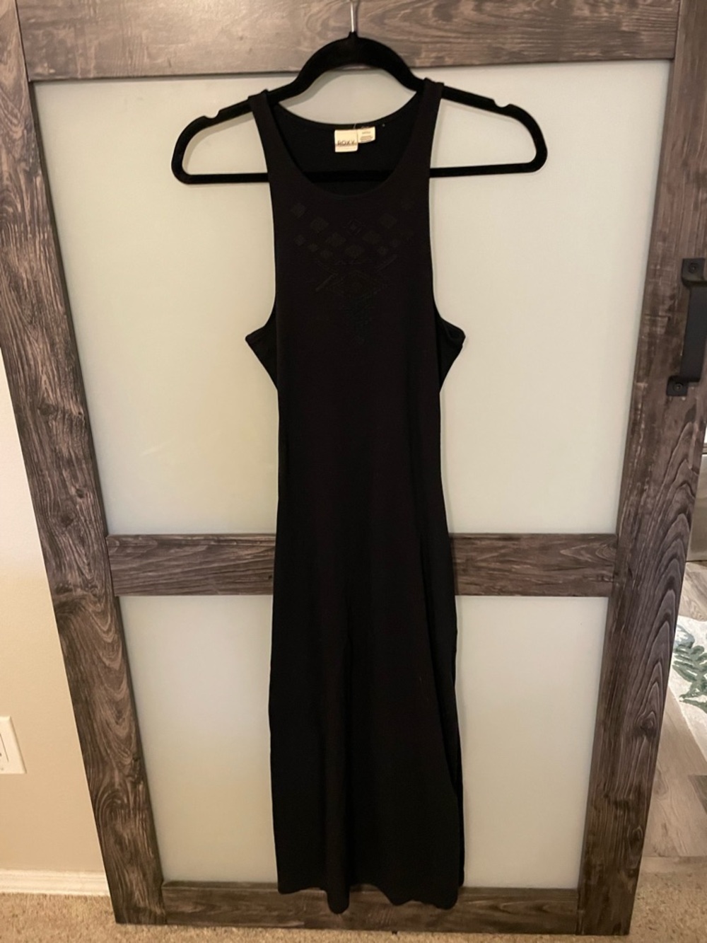 Flattering and form fitting Black Women's Dress. Open in back.